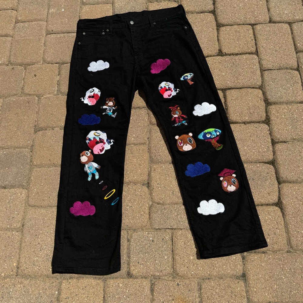 Black vintage Levi jeans with Kanye west graduation inspired patches sewn on